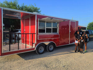 Image of a family next to a food truck