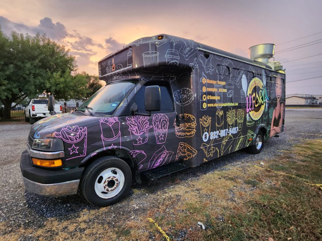 Dark-colored food truck seen from outside.